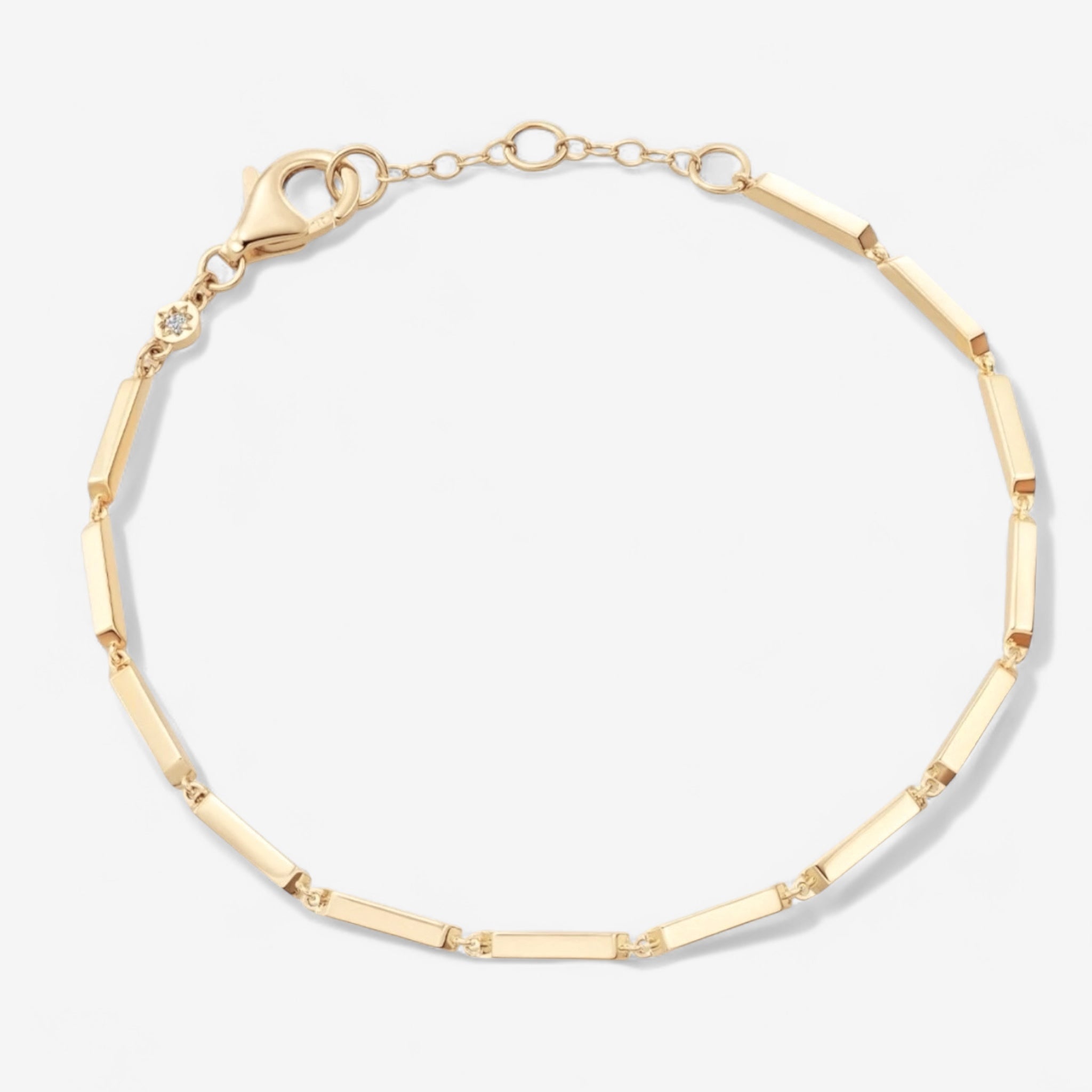 The Emmie Bracelet is a delicate 14k gold plated piece with thin rectangular links and a lobster clasp, shown on a white background.