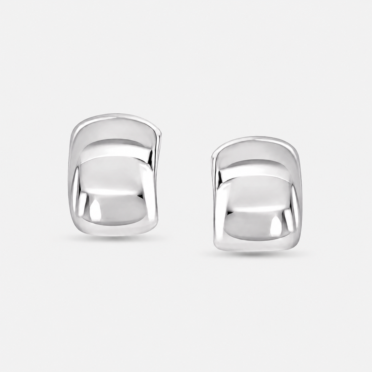 Luxxy Brookes Curved Stud Earrings in silver with sculptural curved design and rhodium finish