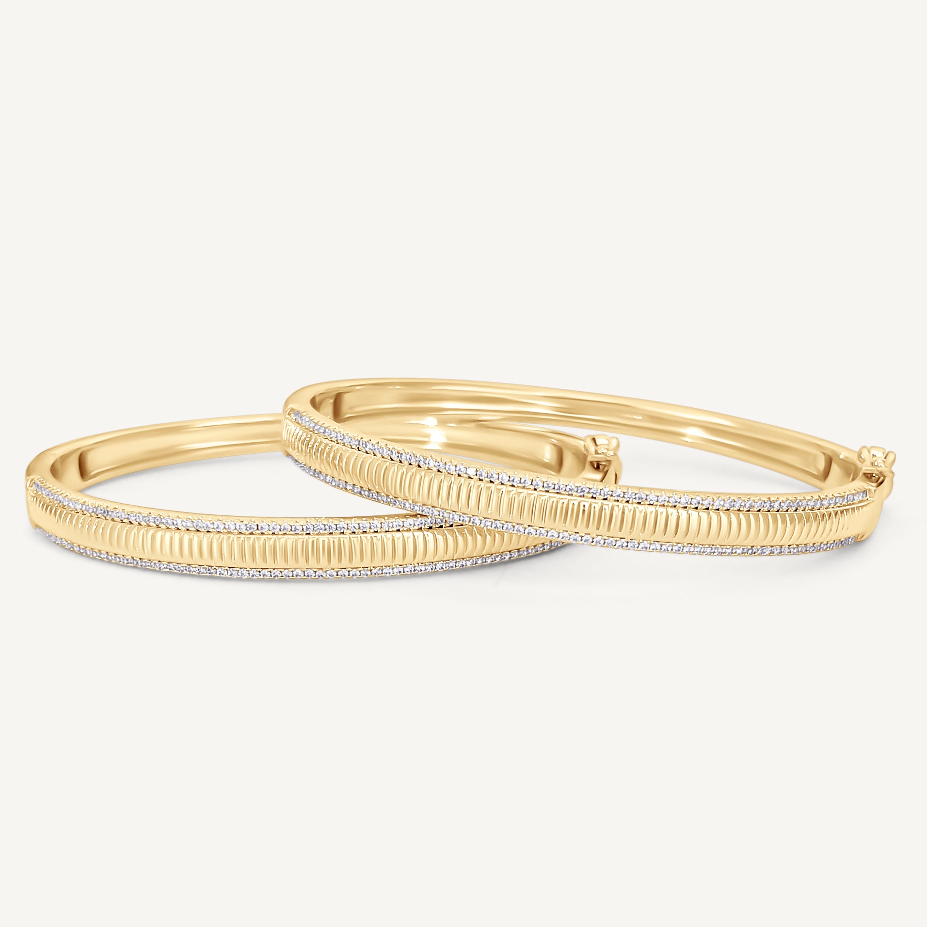 Alyssa Fluted Bangle showcases intricate, textured detailing and a slim, sparkling border inspired by simulated diamonds, displayed against a plain light background.