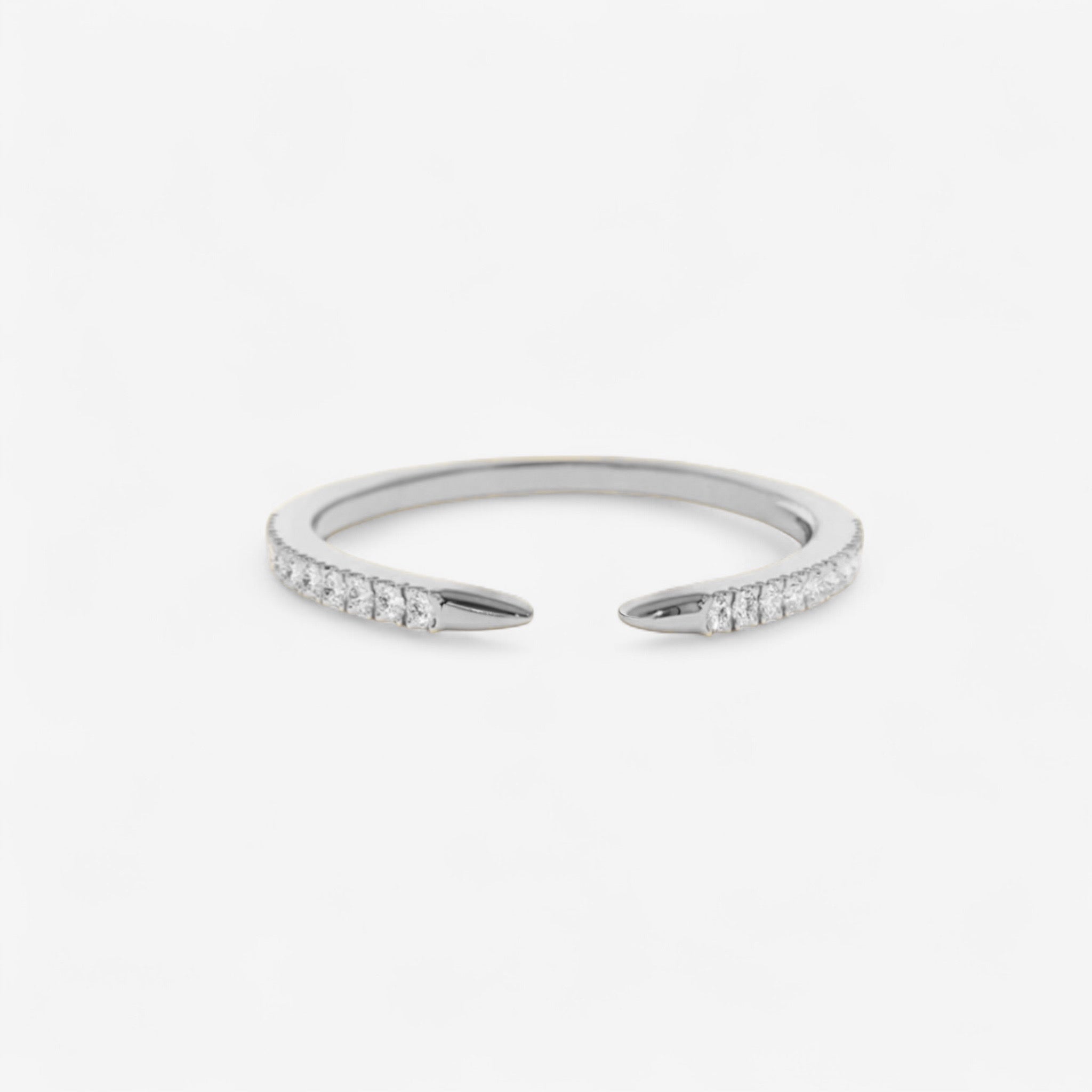 The Chloe Claw Ring is a minimalist sterling silver ring featuring small simulated diamonds along the top half, shown on a white background.