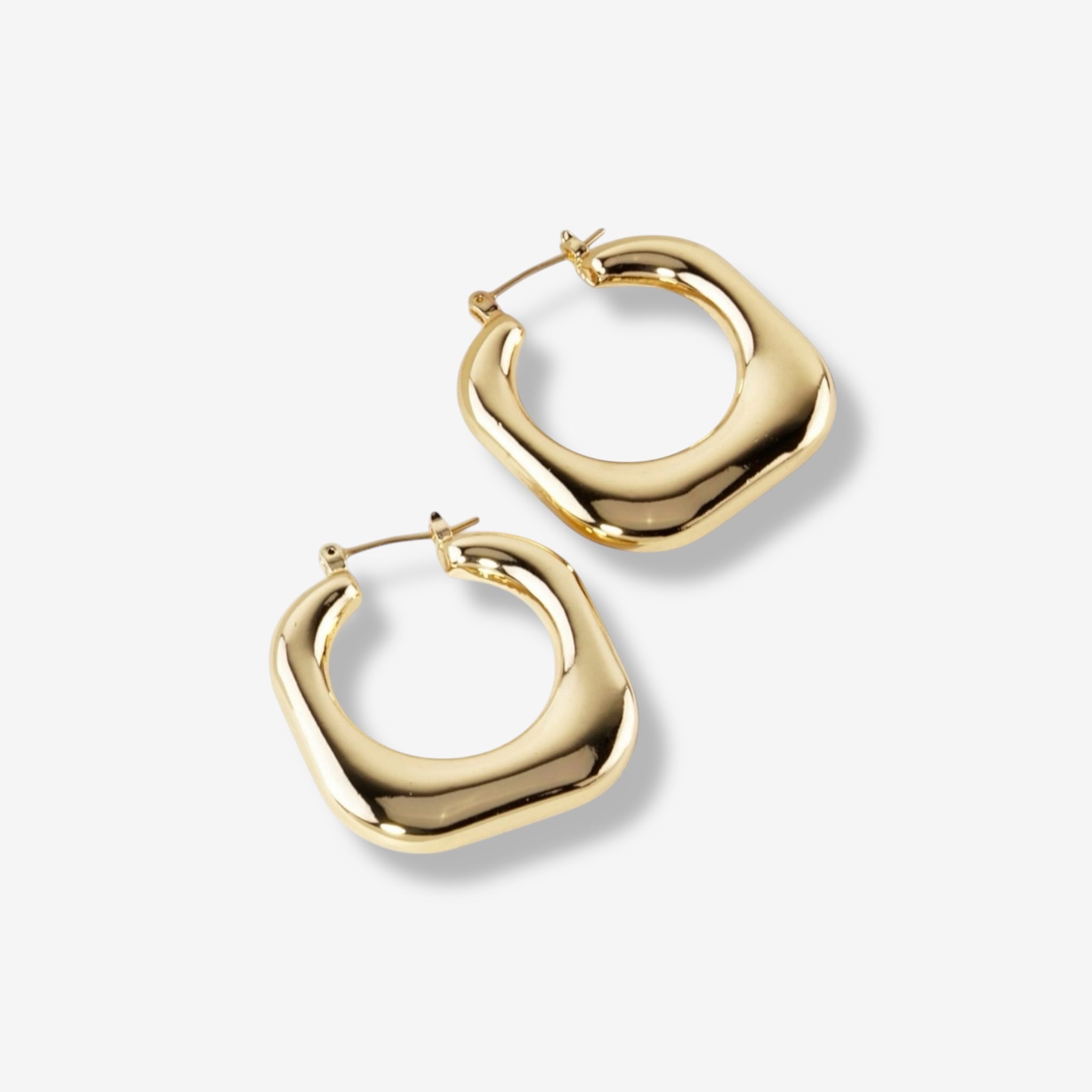 Stormy Squared Hoops: Chunky, shiny gold hoop earrings with a square-shaped design, shown on a plain white background—ideal for fans of modern gold earrings.