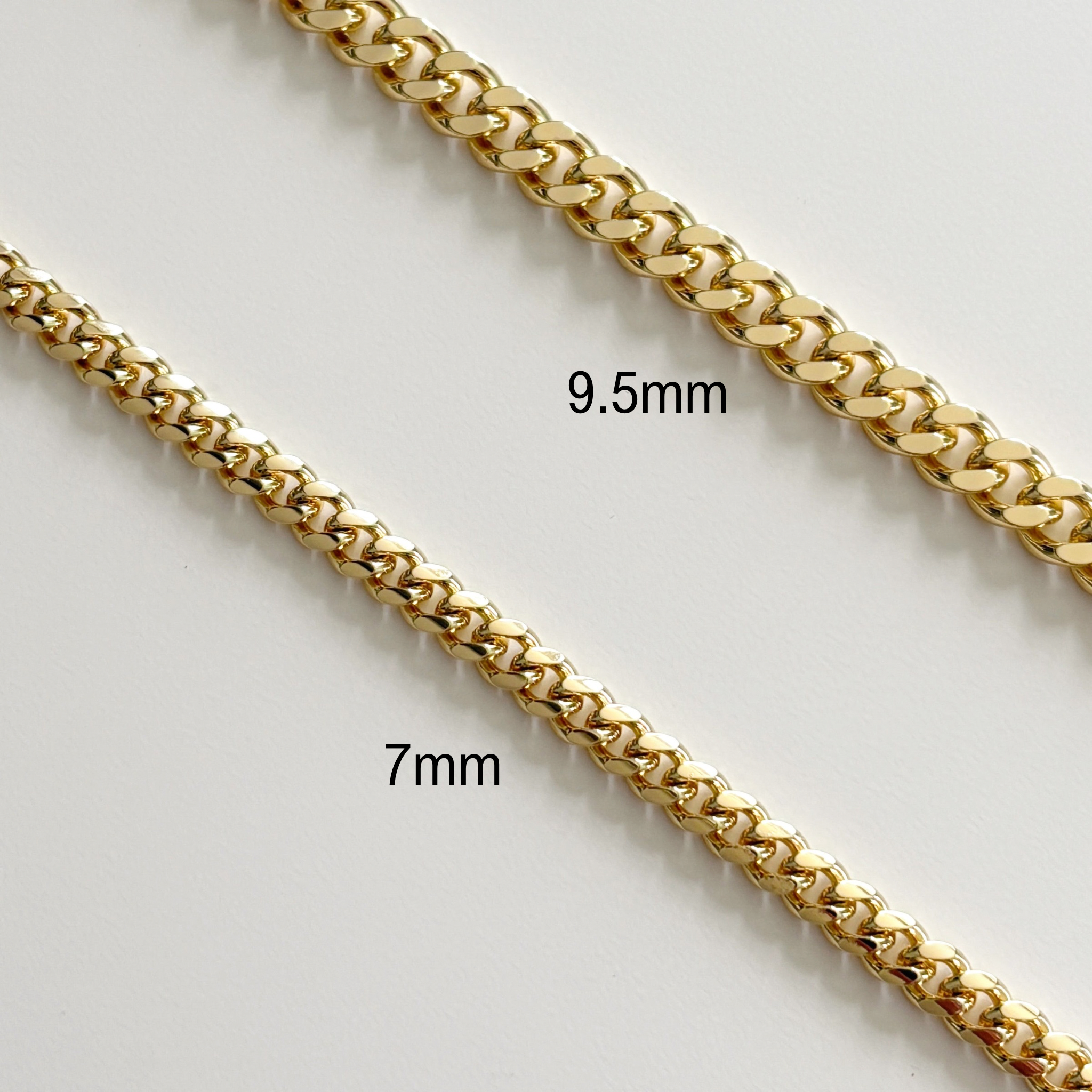 Two Zoe Statement Curb Chains are displayed on a white surface, with the top chain labeled 9.5mm and the bottom labeled 7mm, highlighting their thickness difference for a bold statement look.