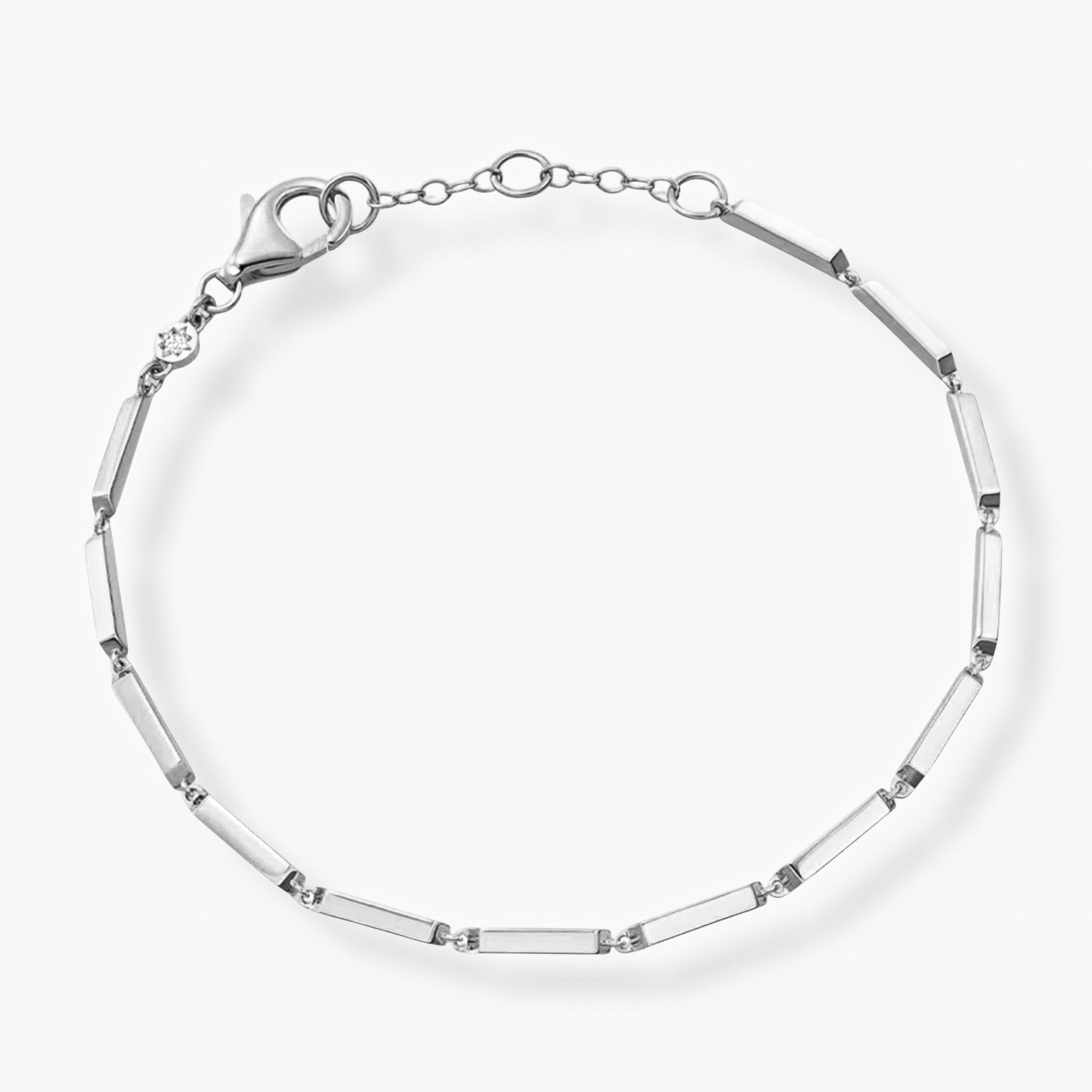 The Emmie Bracelet is a delicate sterling silver bar bracelet with rectangular links, round connectors, and a lobster clasp, shown against a plain white background.