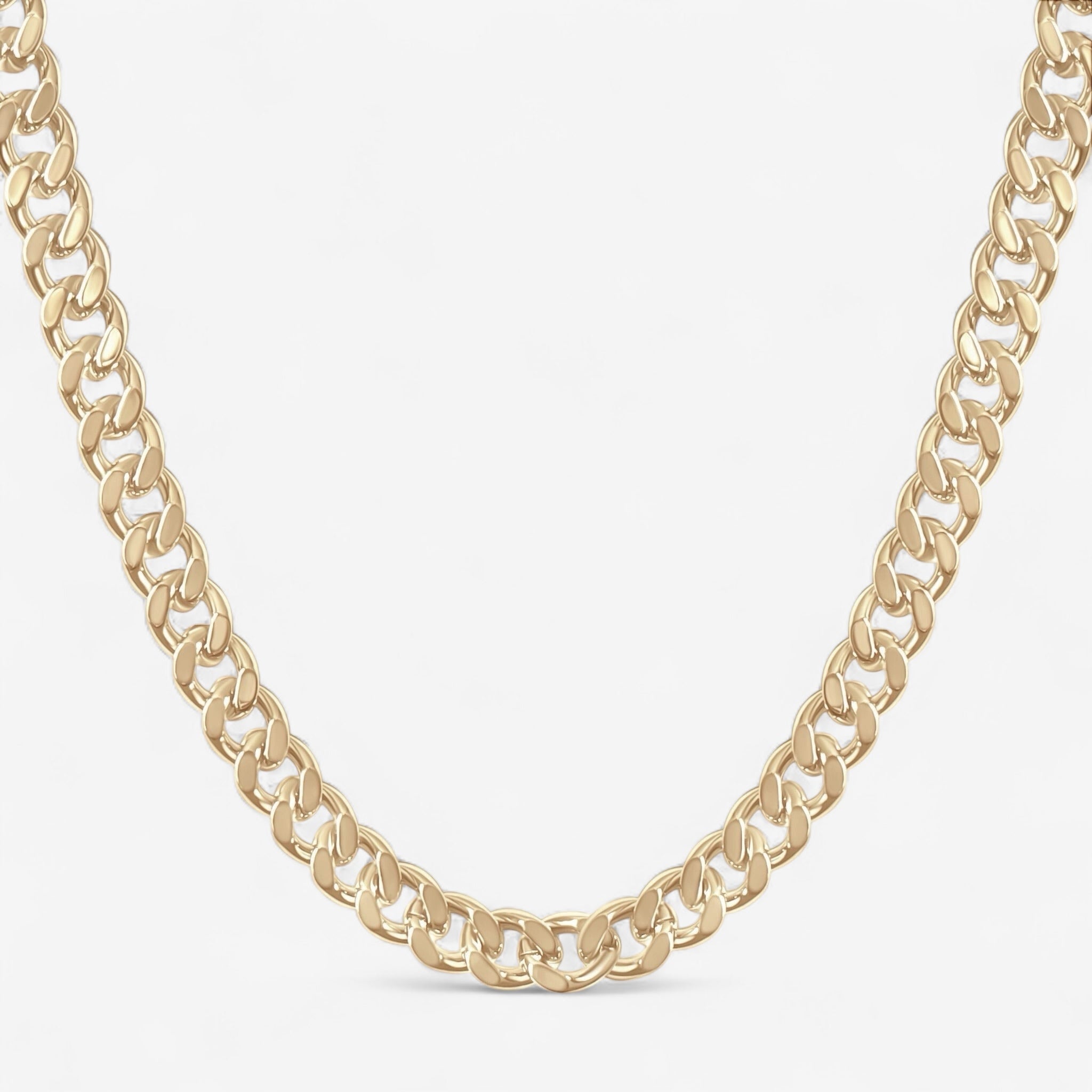 The Zoe Statement Curb Chain, featuring interlocking flat and wide gold links, is displayed against a plain white background, making a bold statement piece.