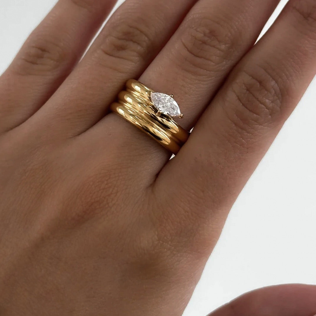 Detailed view of the Melia Ring on a model highlighting the polished gold finish and bold stacked silhouette