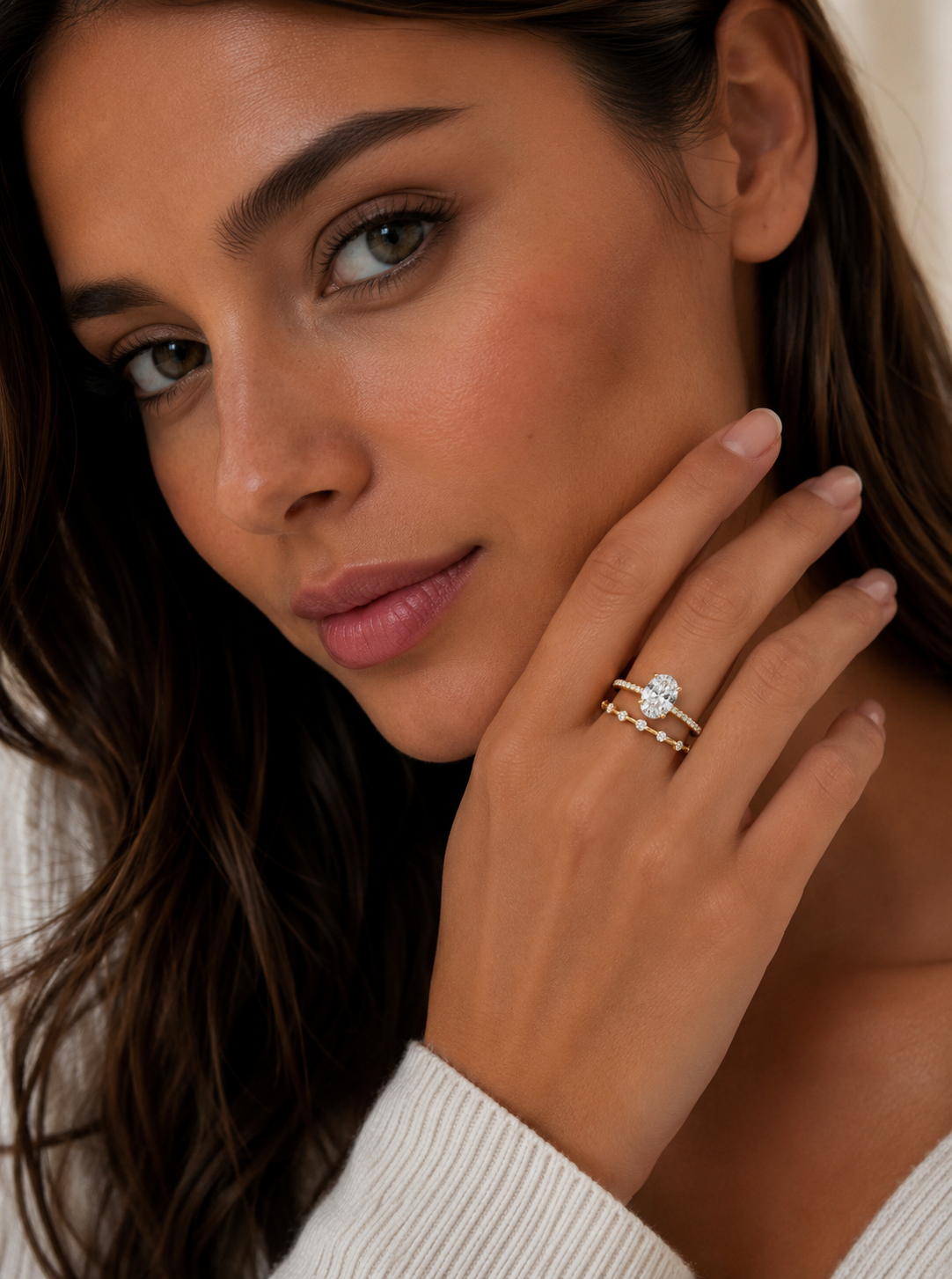 Meliss Dainty Sparkle Ring in gold shown on model’s hand delicate minimalist band with six micro pave diamonds styled with oval CZ ring for everyday wear