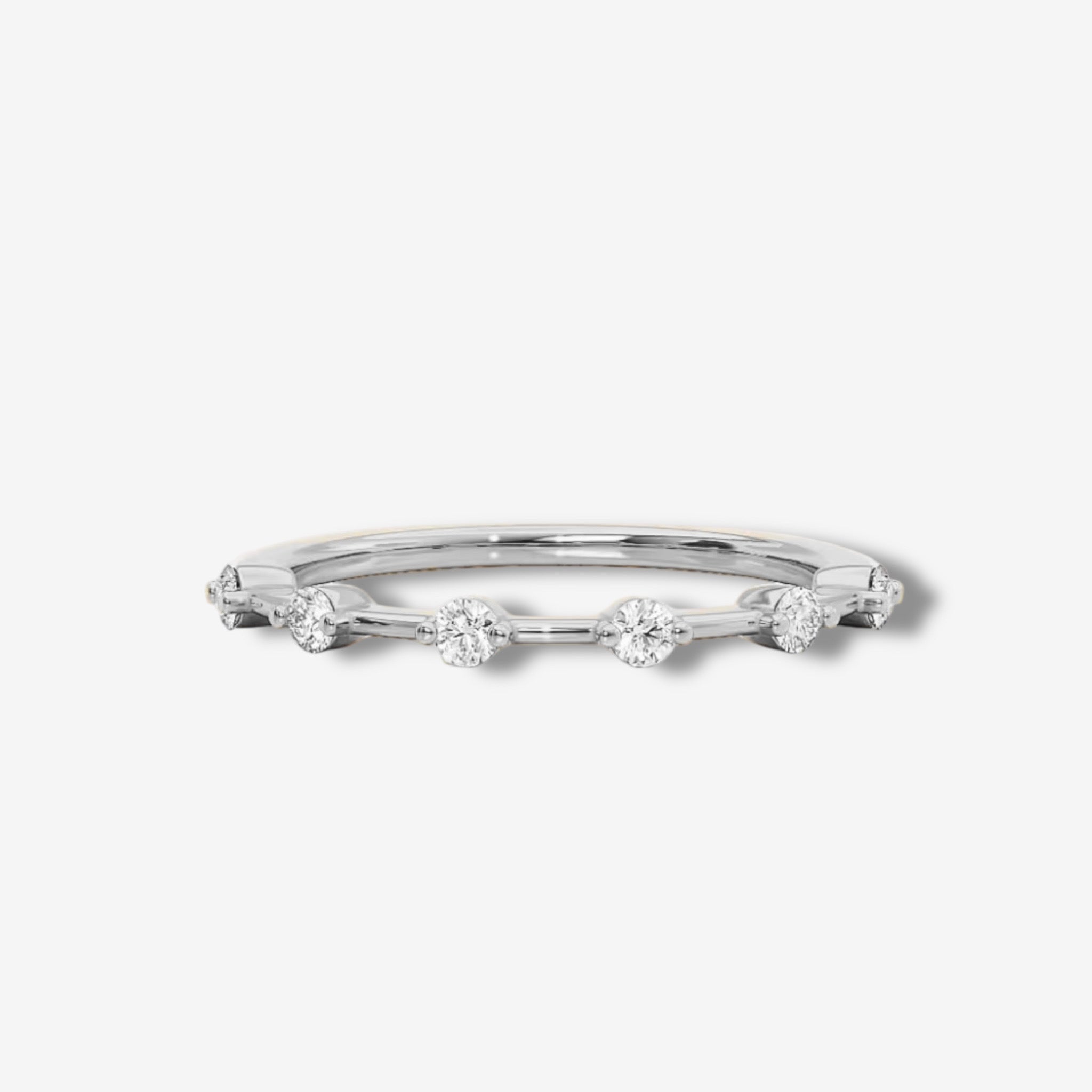 The Meliss Dainty Sparkle Ring – Silver is a thin sterling silver band featuring five evenly spaced round diamonds, shown on a white background.